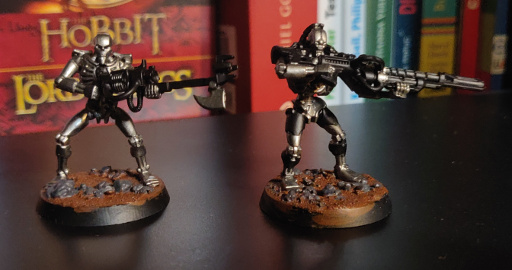 Basecoated the base, metal parts of the miniature and, of course, the weapon